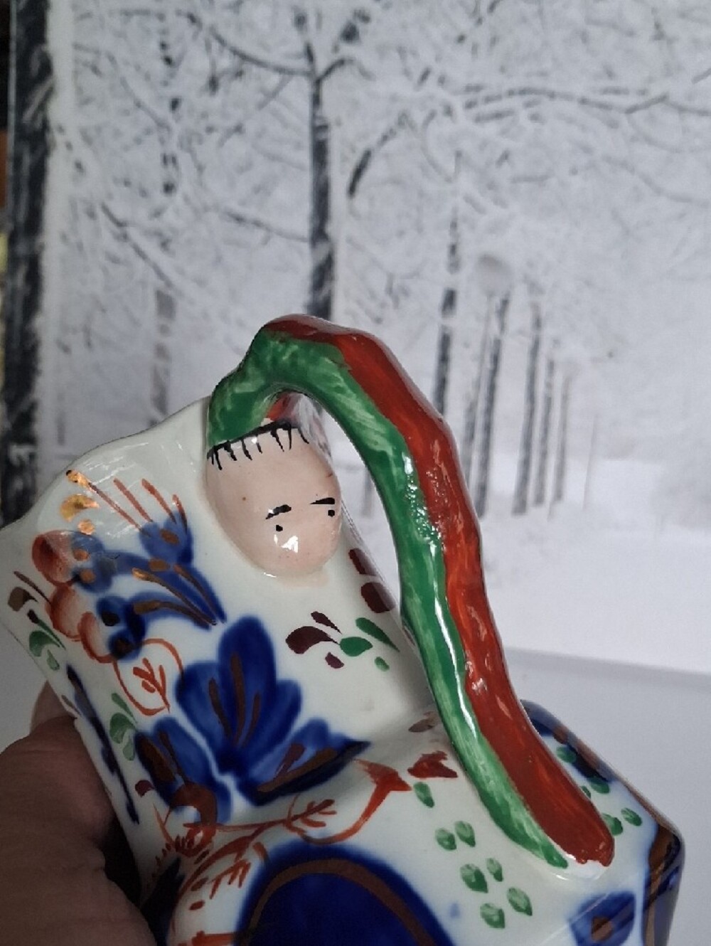 Hand-Painted Ceramic Pitcher with Blue Floral Motif and Green Handle - Picture 2 of 4